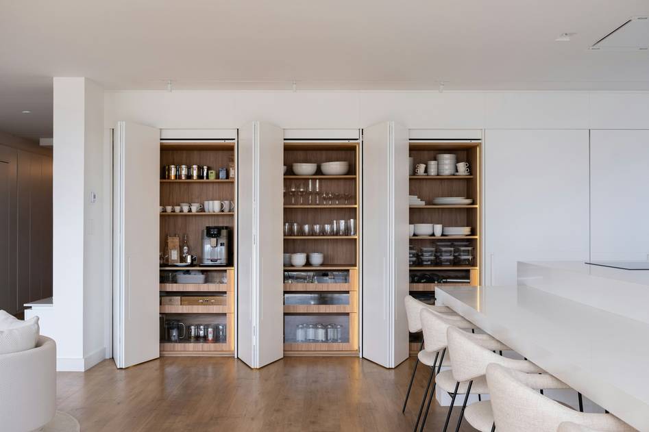 Freshly prepped meals in glass containers on a wooden table