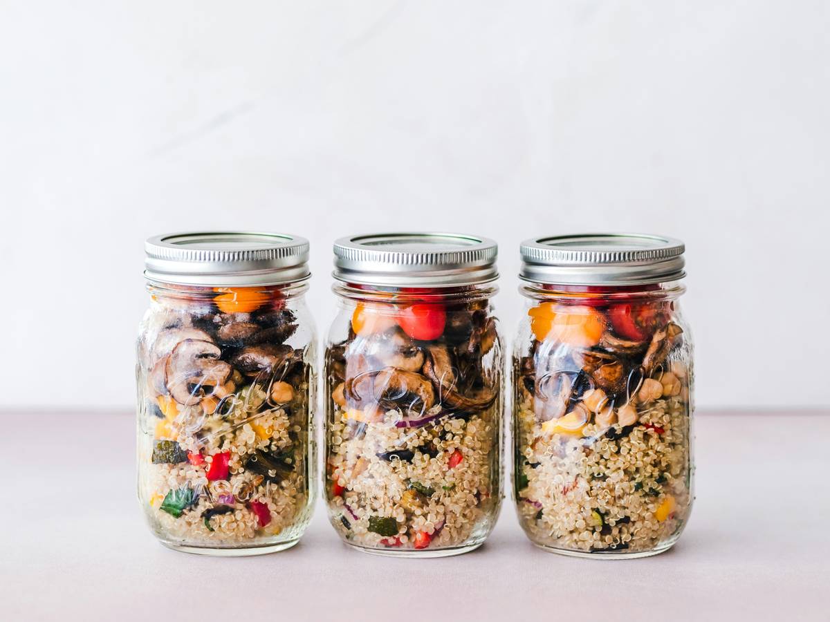 Organized meal prep containers from a dishwasher safe set stacked neatly in a kitchen