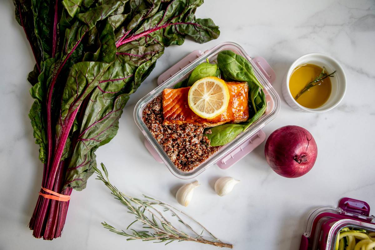 Meal prep containers with marinated chicken and vegetables using marinate ahead tip